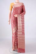 Coral Banarasi Tussar Saree with Zari Brocade on the body and Zari And Thread Border.  displayed on a mannequin