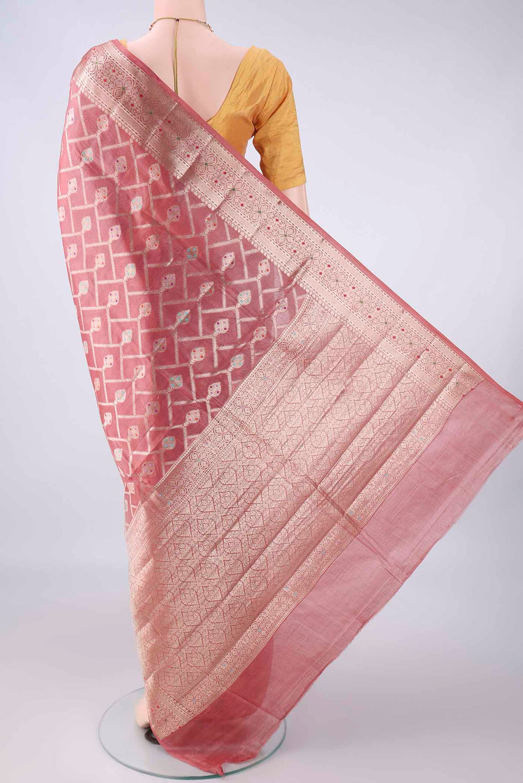 Flat view of Coral Banarasi Tussar Saree with Zari Brocade on the body and Zari And Thread Border. 
