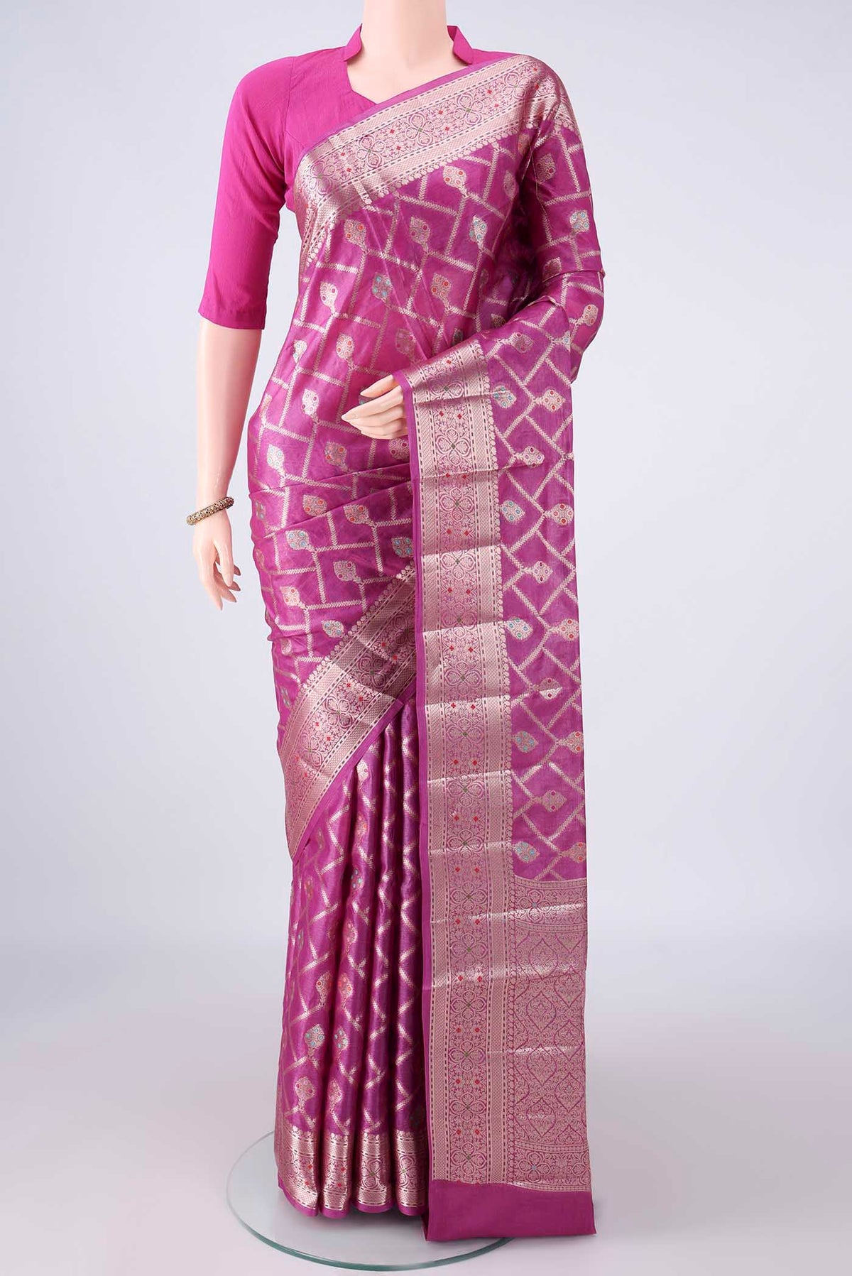 Rani Pink Banarasi Tussar Saree with Zari Brocade on the body and Zari And Thread Border.  displayed on a mannequin