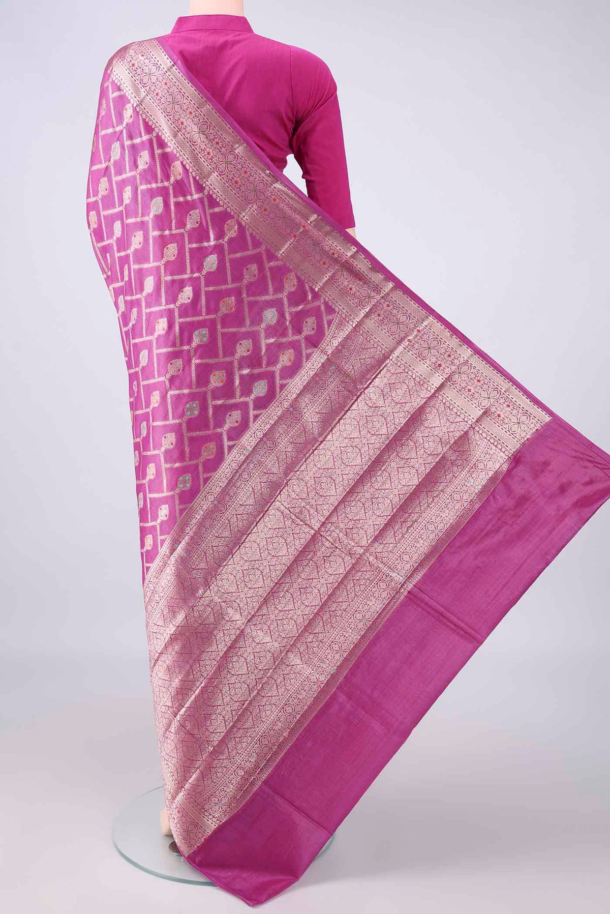 Flat view of Rani Pink Banarasi Tussar Saree with Zari Brocade on the body and Zari And Thread Border. 
