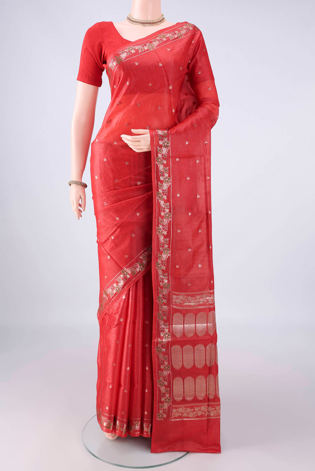 Red Banarasi Tussar Saree with Zari Butta on the body and Zari And Thread Border.  displayed on a mannequin