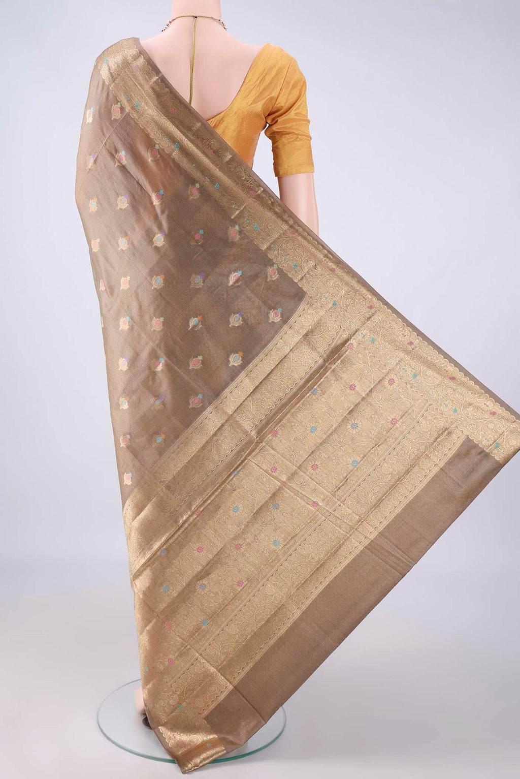 Flat view of Beige Banarasi Tussar Saree with Zari Butta on the body and Zari And Thread Border. 