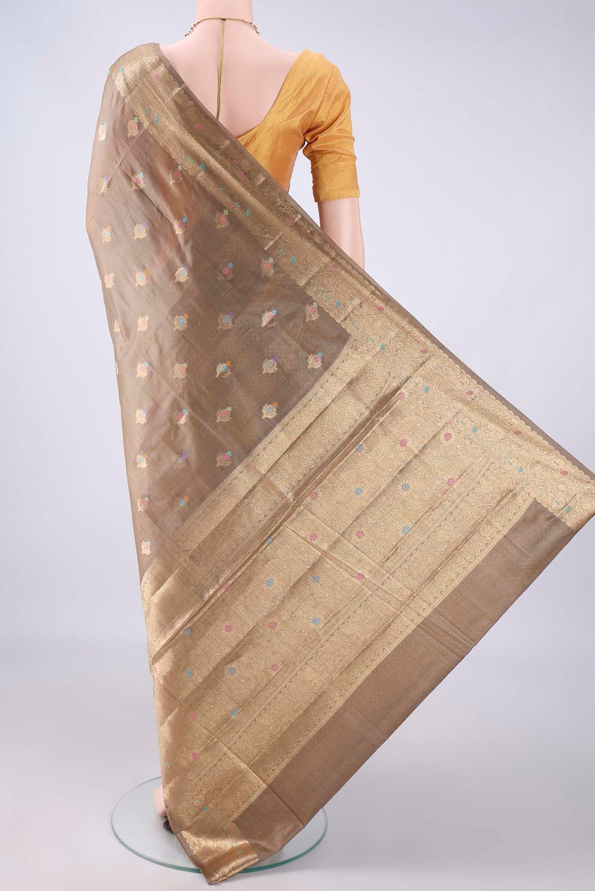 Flat view of Beige Banarasi Tussar Saree with Zari Butta on the body and Zari And Thread Border. 