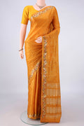 Mustard Banarasi Tussar Saree with Zari Butta on the body and Zari And Thread Border.  displayed on a mannequin