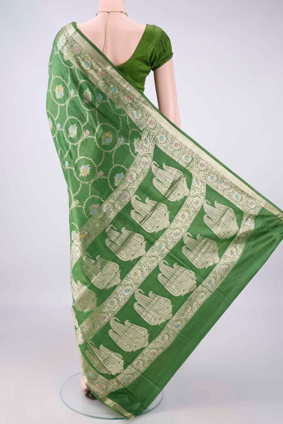 Flat view of Green Banarasi Tussar Saree with Zari Brocade on the body and Zari Border. 