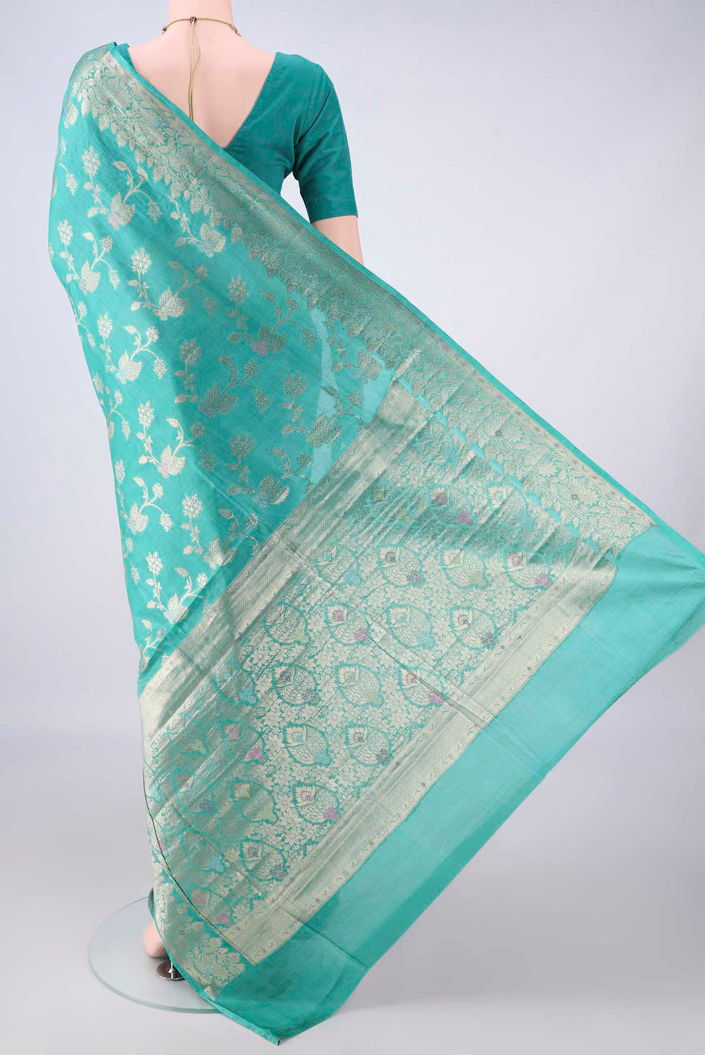 Flat view of Sea Green Banarasi Tussar Saree with Zari Brocade on the body and Zari And Thread Border. 