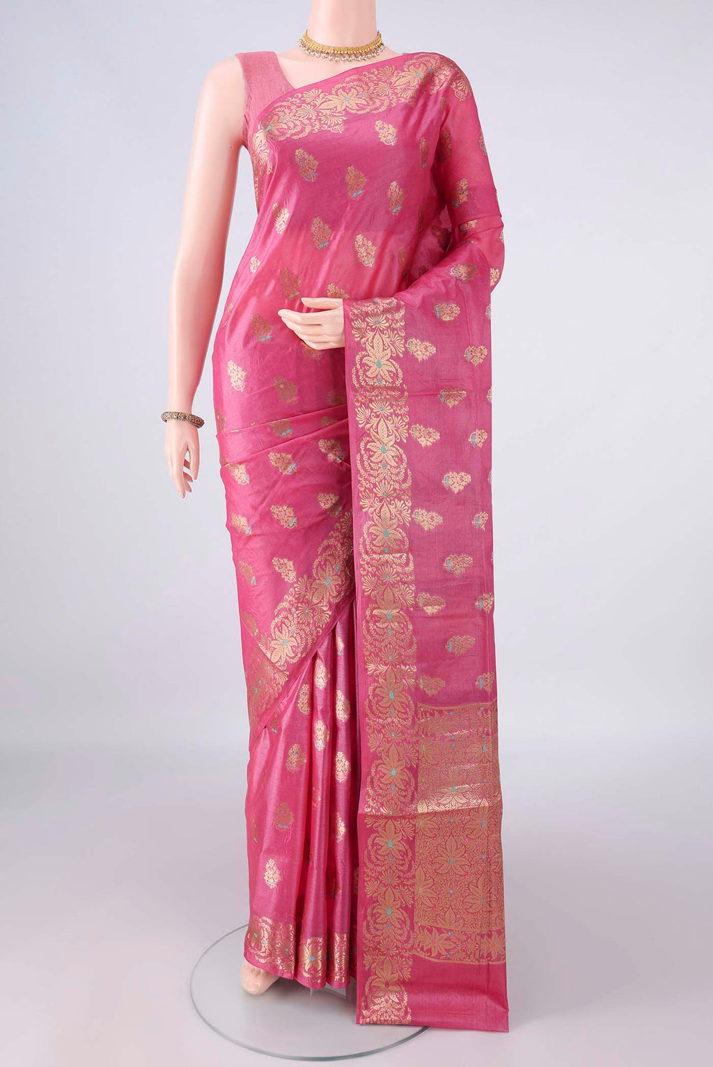 Pink Banarasi Tussar Saree with Zari Butta on the body and Zari Border.  displayed on a mannequin
