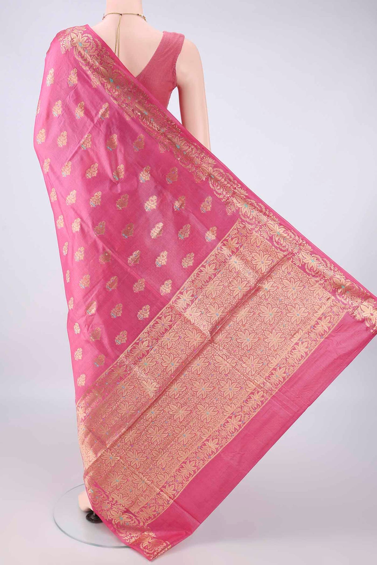 Flat view of Pink Banarasi Tussar Saree with Zari Butta on the body and Zari Border. 