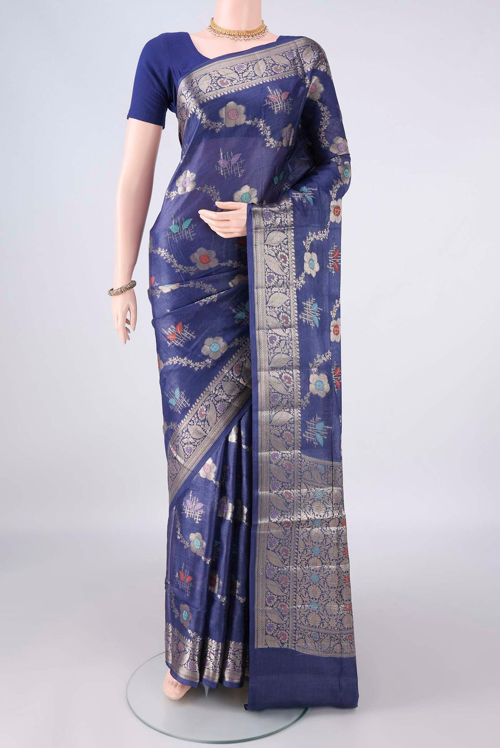 Royal Blue Banarasi Tussar Saree with Zari Brocade on the body and Zari And Thread Border.  displayed on a mannequin