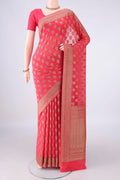 Coral Banarasi Georgette Saree with Zari Butta on the body and Zari Border.  displayed on a mannequin