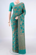 Pure Silk Sea Green Paithani Saree with Zari Brocade on the body and Zari Border.  displayed on a mannequin