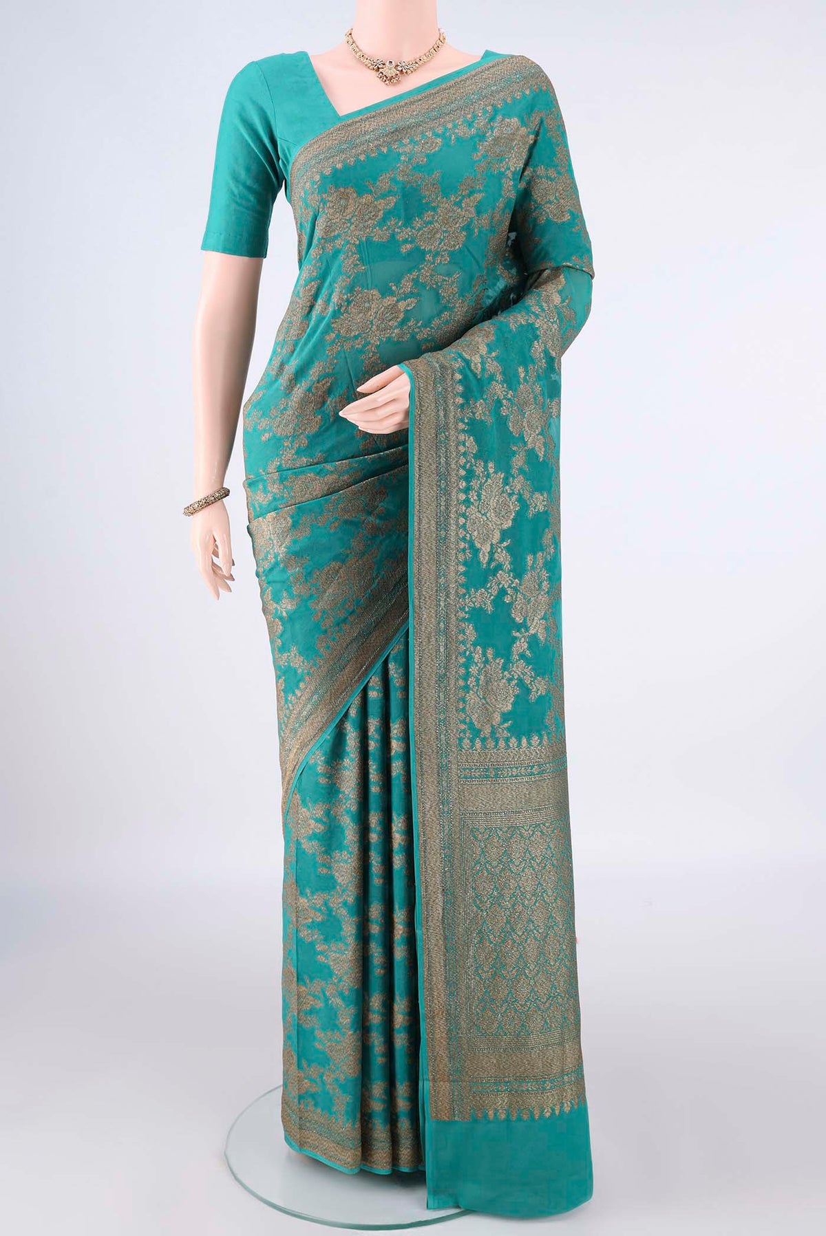 Pure Silk Sea Green Paithani Saree with Zari Brocade on the body and Zari Border.  displayed on a mannequin