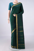 Pure Silk Bottle Green Kanjivaram Saree with Plain Body and Zari Border.  displayed on a mannequin