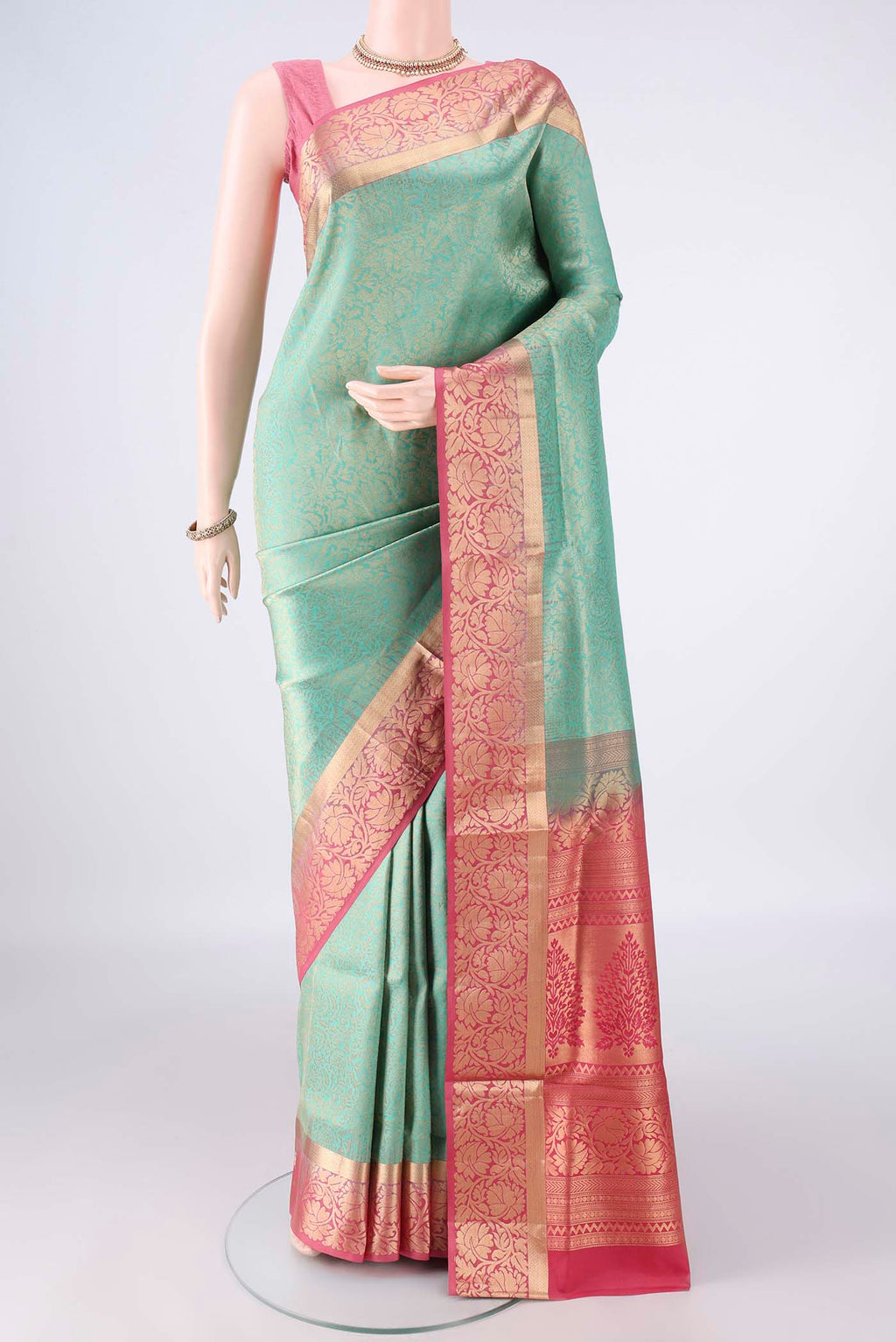 Pure Silk Turquoise Soft Saree with Zari Brocade on the body and Zari Border.  displayed on a mannequin