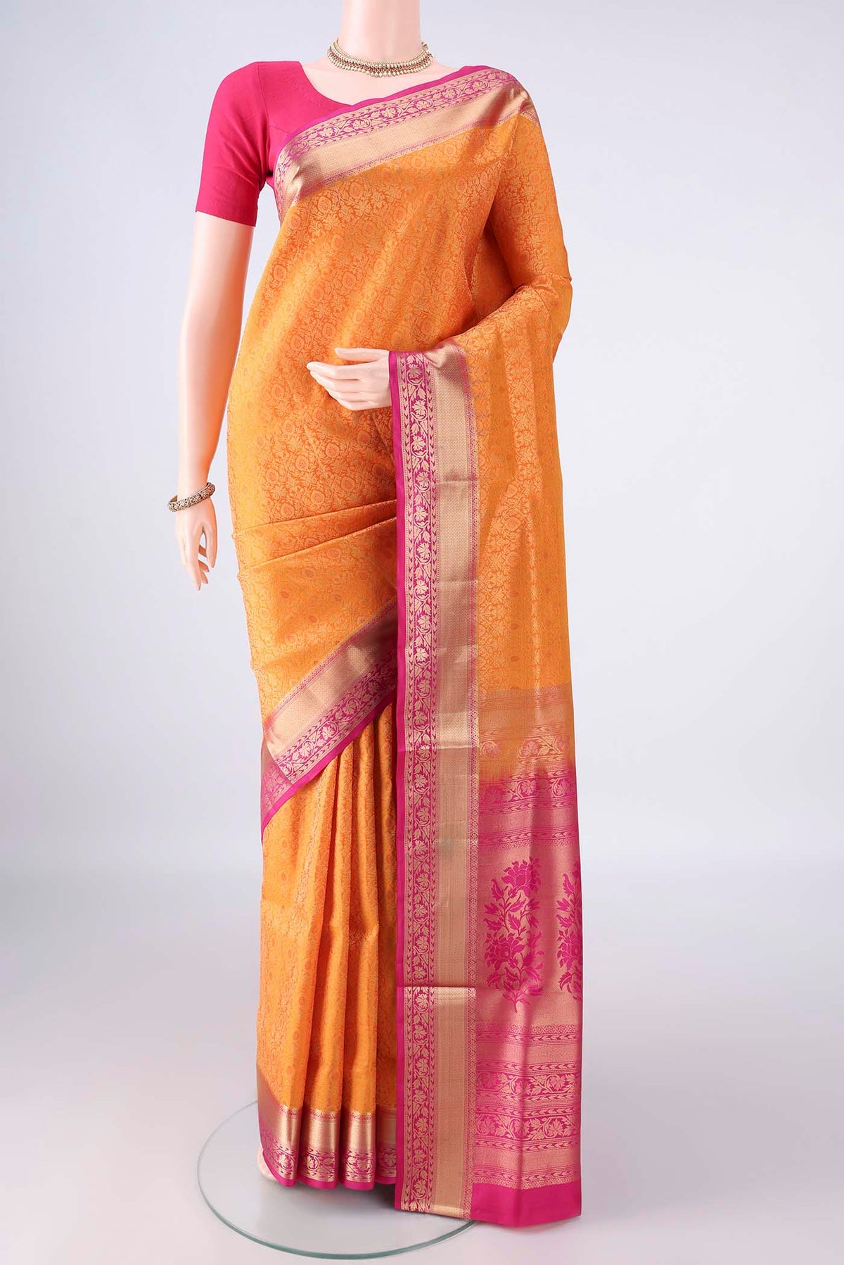 Pure Silk Yellow Soft Saree with Zari Brocade on the body and Zari Border.  displayed on a mannequin