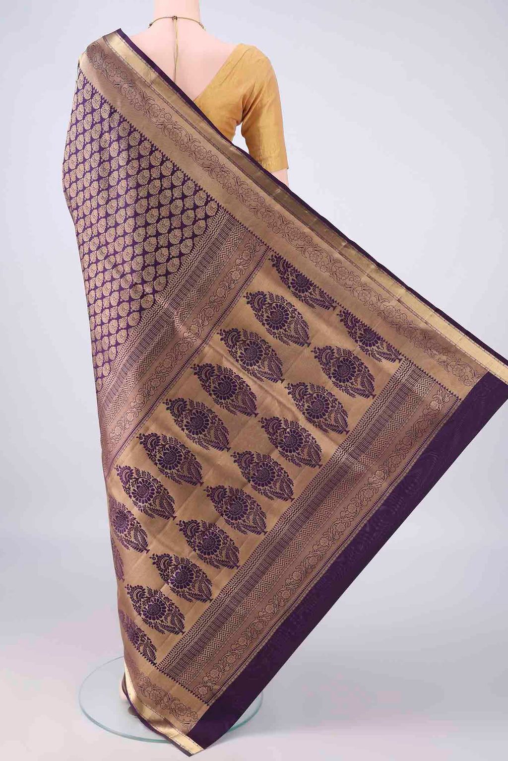 Flat view of Pure Silk Purple Soft Saree with Zari Brocade on the body and Zari Border. 