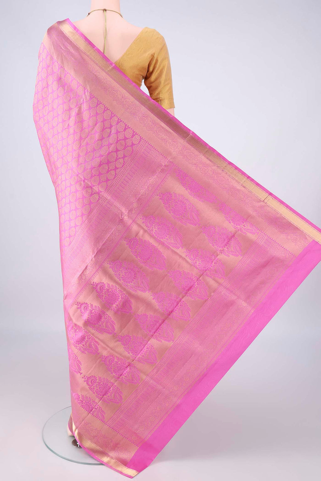 Flat view of Pure Silk Pink Soft Saree with Zari Brocade on the body and Zari Border. 