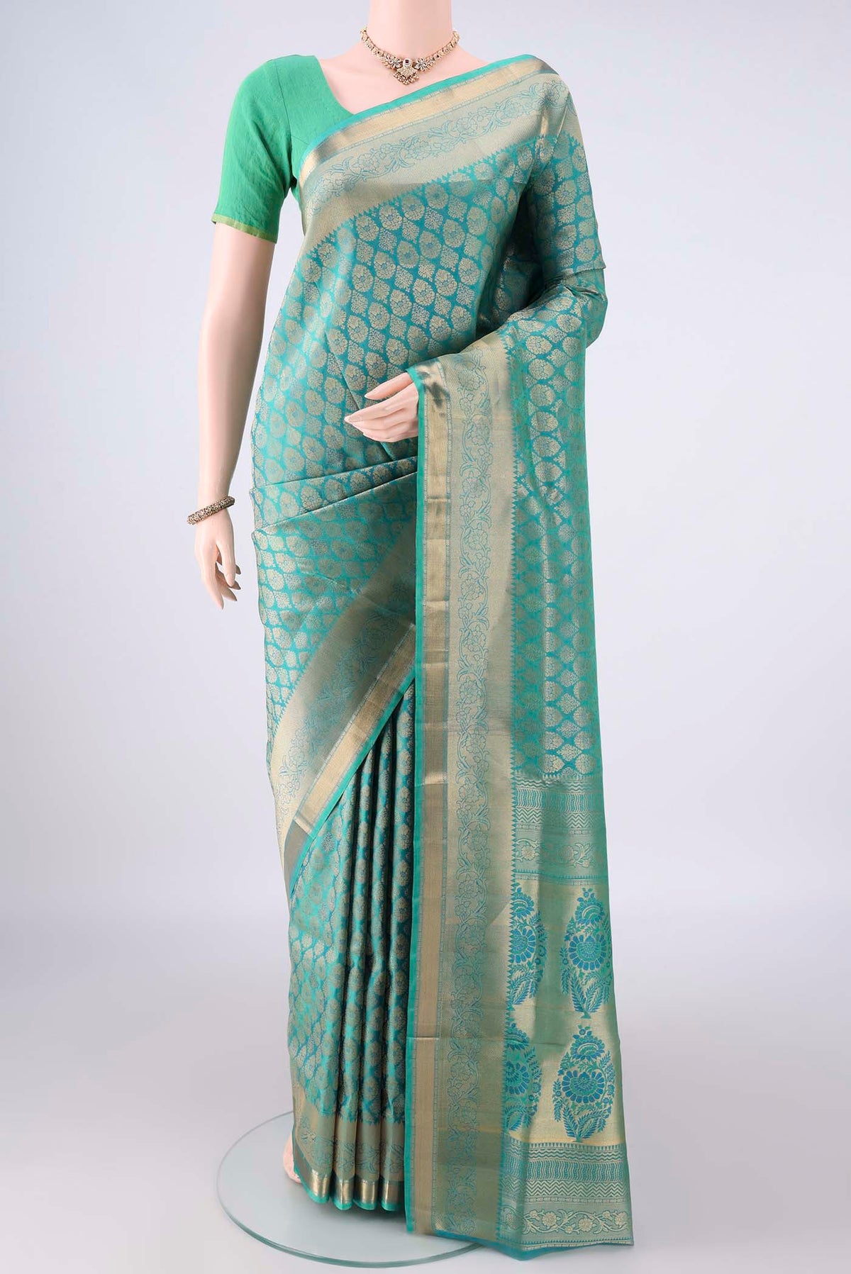 Pure Silk Turquoise Dual Tone Soft Saree with Zari Brocade on the body and Zari Border.  displayed on a mannequin
