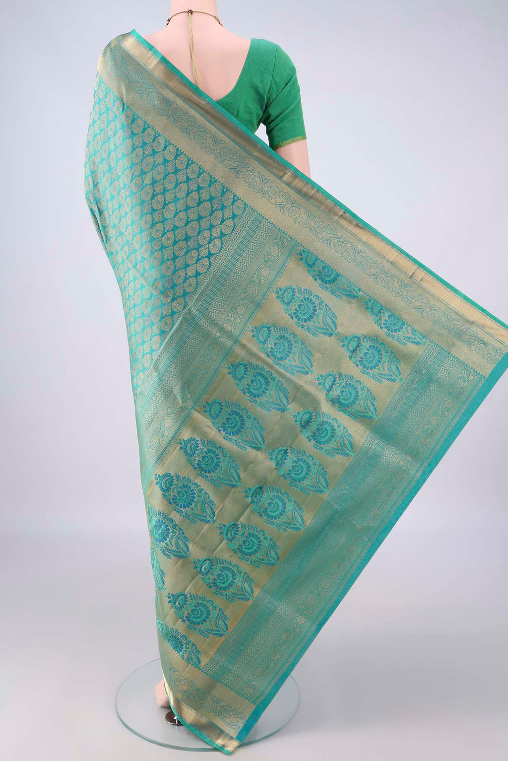 Flat view of Pure Silk Turquoise Dual Tone Soft Saree with Zari Brocade on the body and Zari Border. 