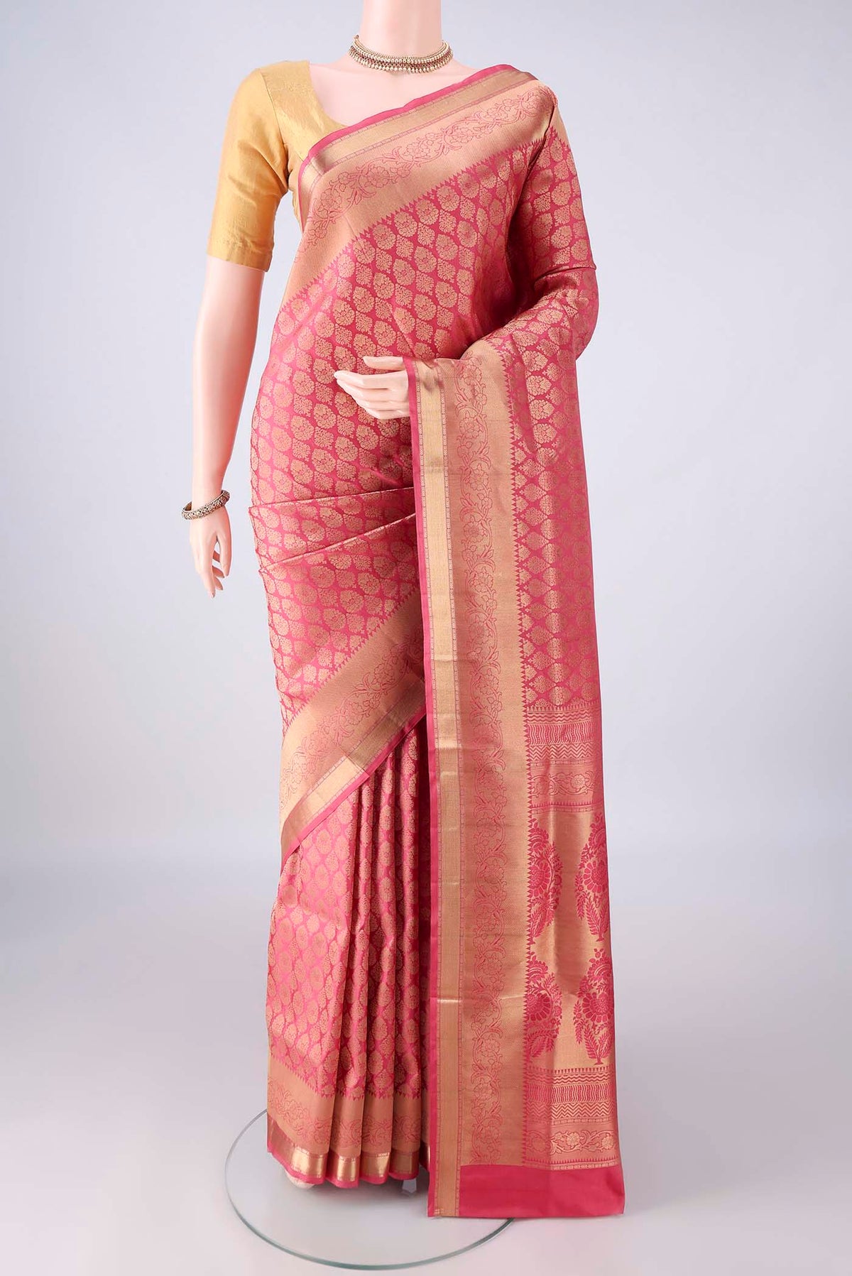 Pure Silk Coral Soft Saree with Zari Brocade on the body and Zari Border.  displayed on a mannequin