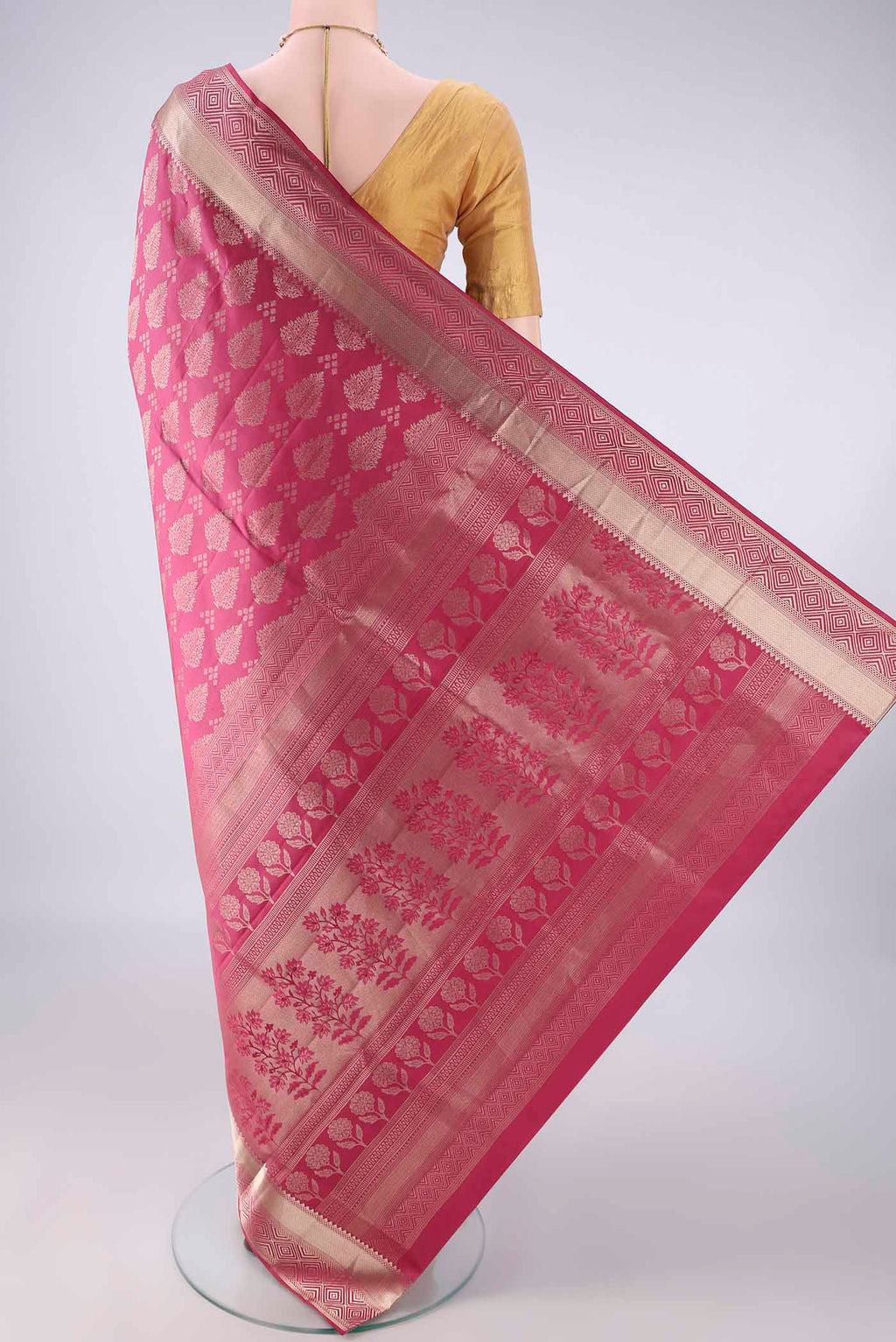 Flat view of Pure Silk Imperial Pink Soft Saree with Zari Butta on the body and Zari Border. 