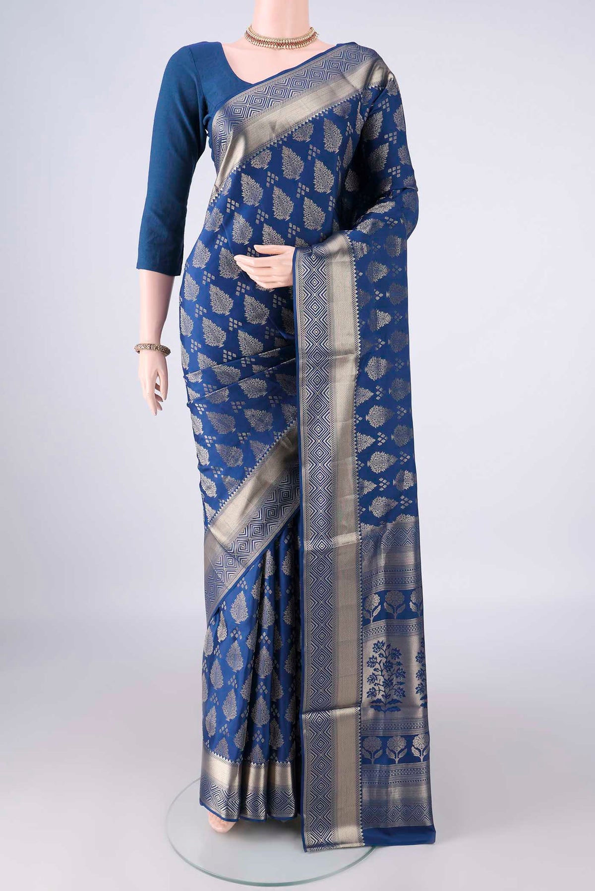 Pure Silk Blue Soft Saree with Zari Butta on the body and Zari Border.  displayed on a mannequin