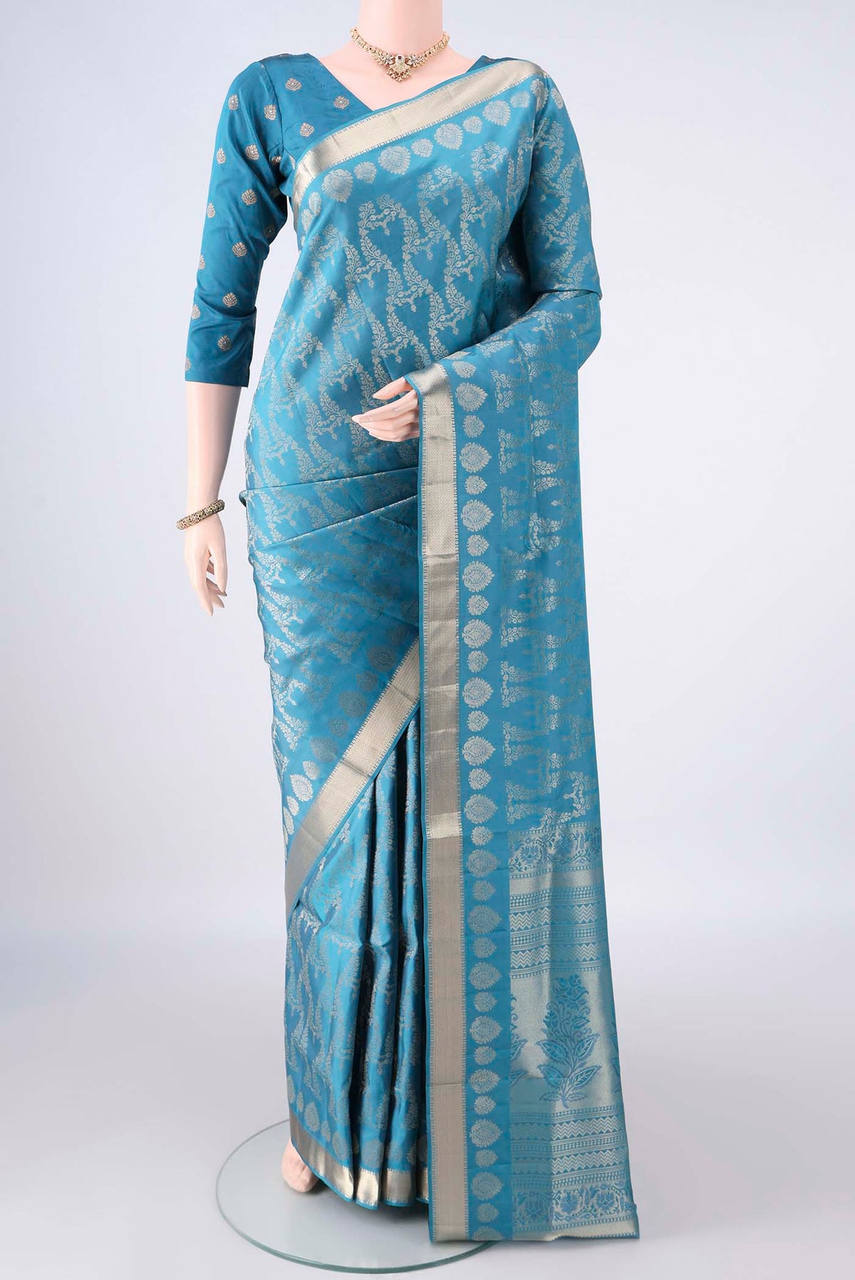 Pure Silk Blue Soft Saree with Zari Brocade on the body and Zari Border.  displayed on a mannequin