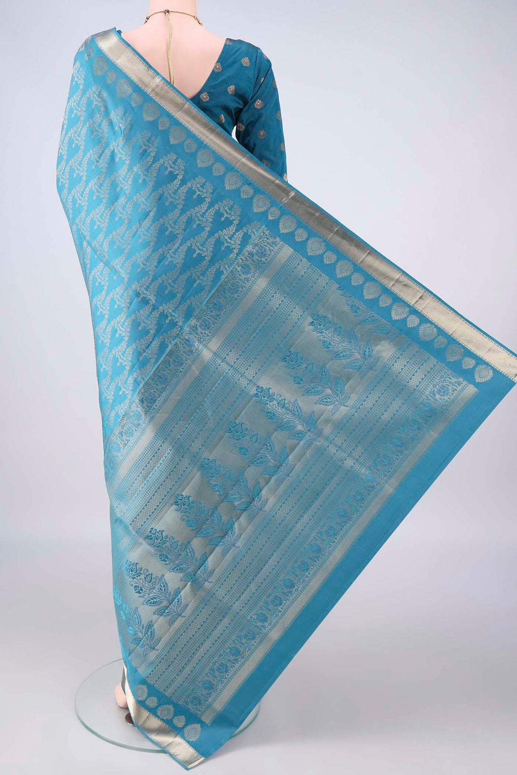 Flat view of Pure Silk Blue Soft Saree with Zari Brocade on the body and Zari Border. 