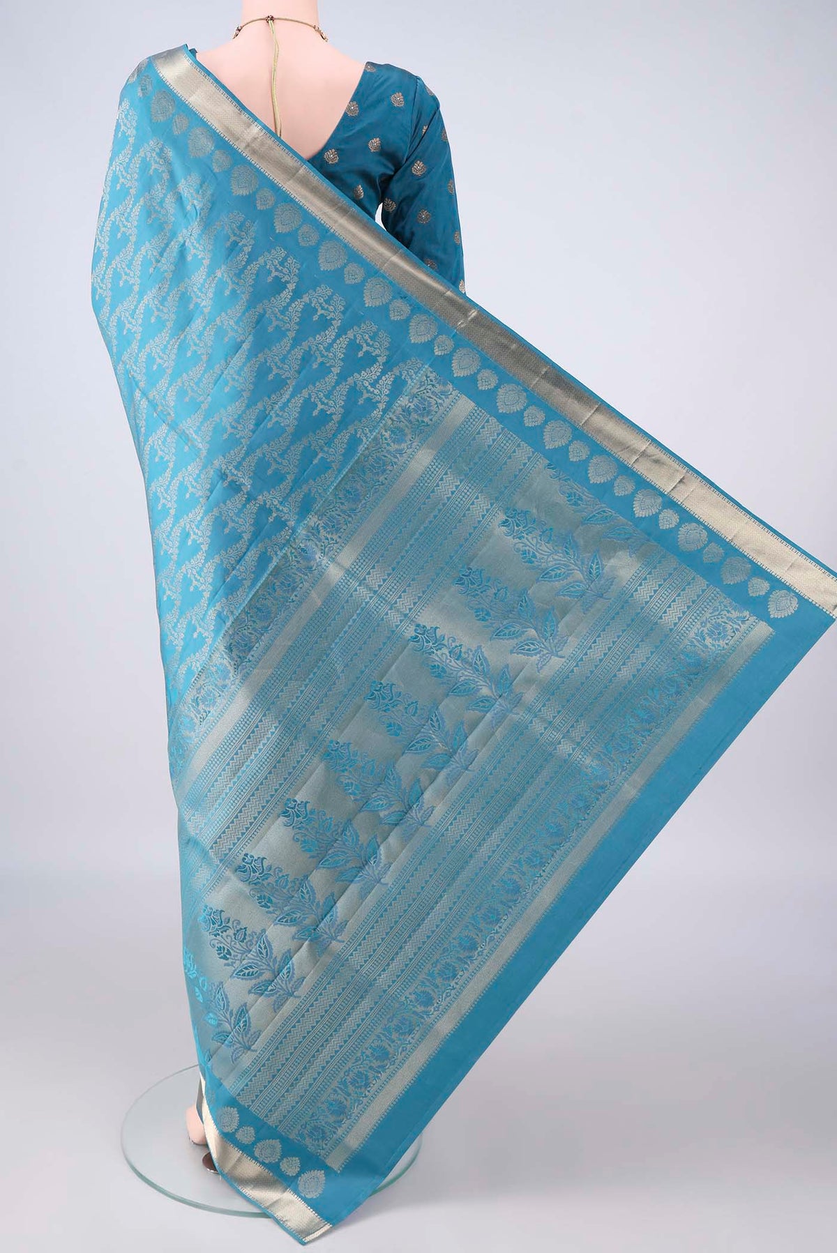 Flat view of Pure Silk Blue Soft Saree with Zari Brocade on the body and Zari Border. 
