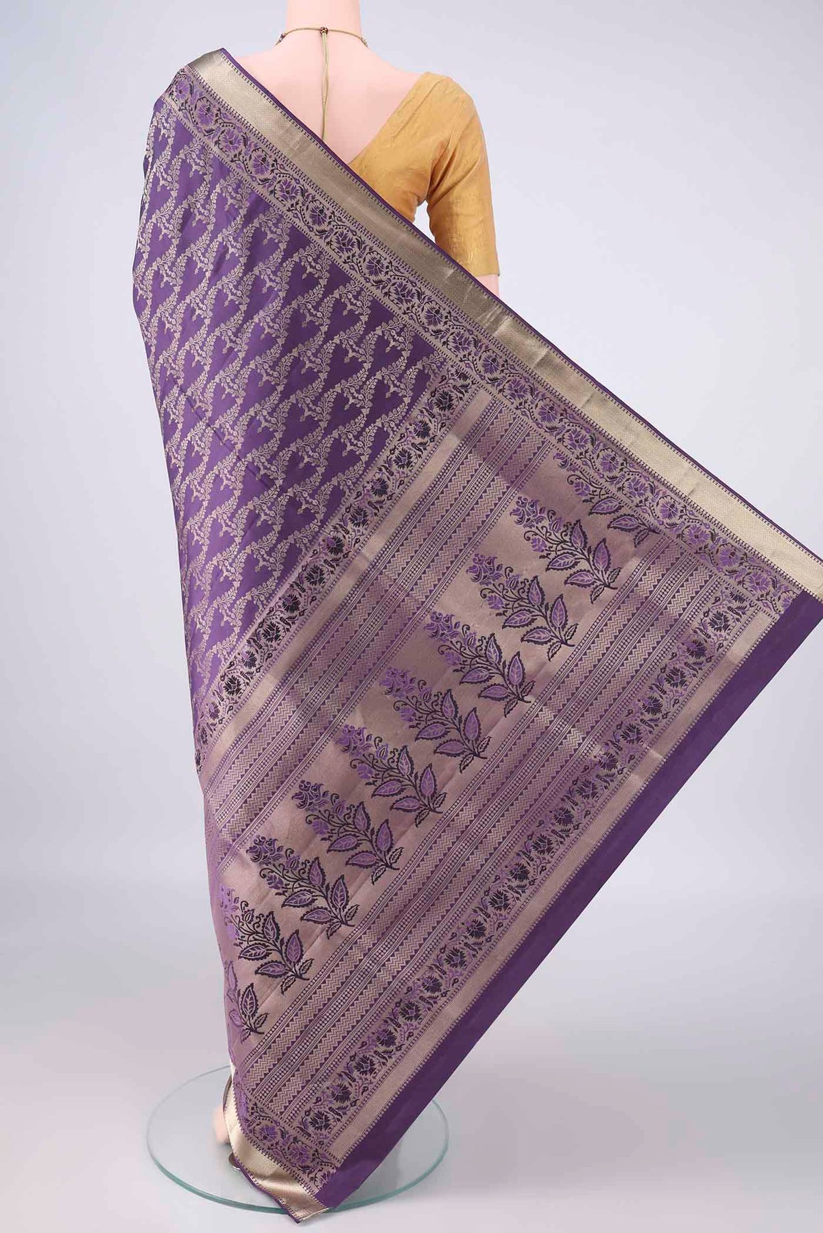Flat view of Pure Silk Violet Soft Saree with Zari Brocade on the body and Zari Border. 