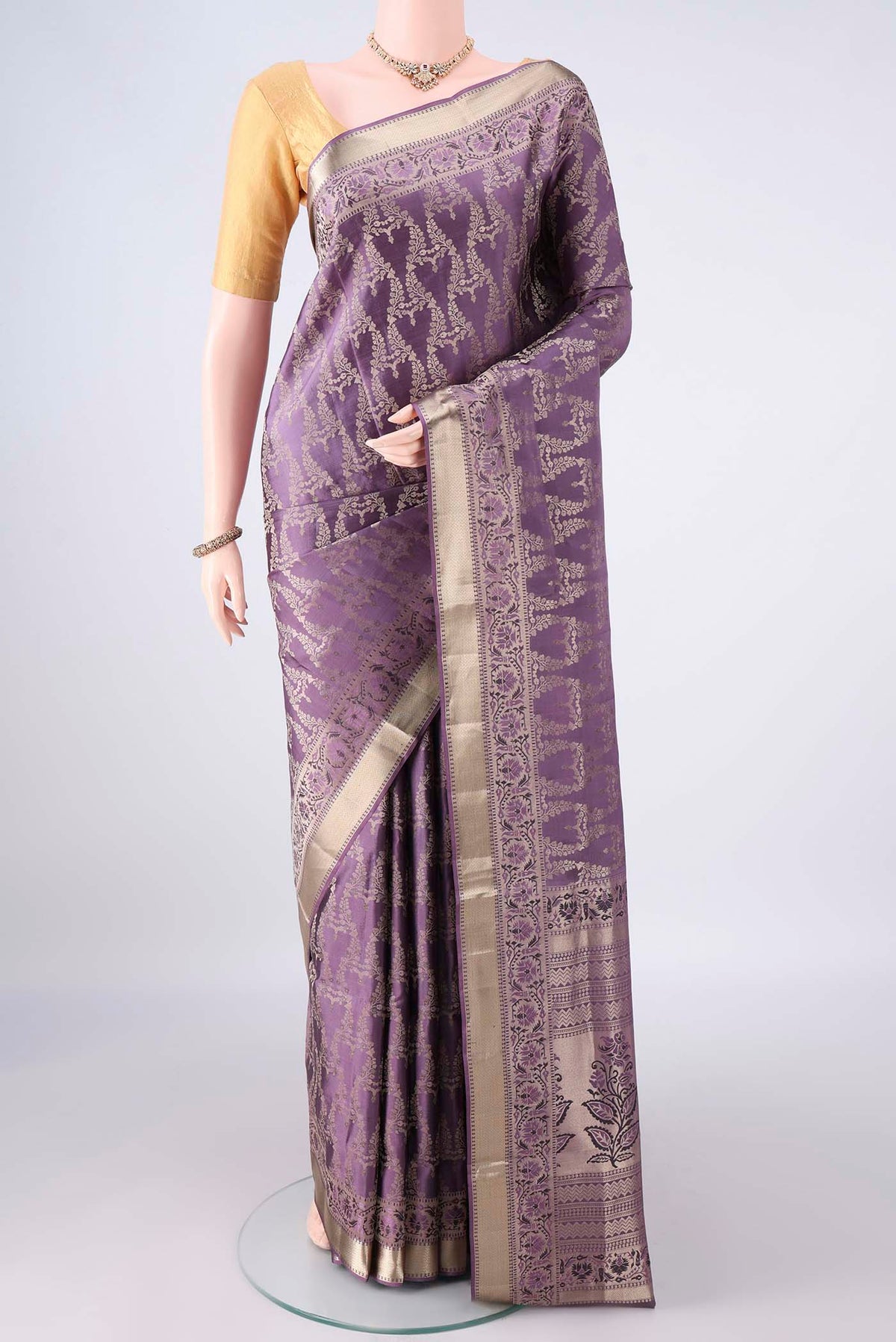 Pure Silk Mauve Soft Saree with Zari Brocade on the body and Zari Border.  displayed on a mannequin
