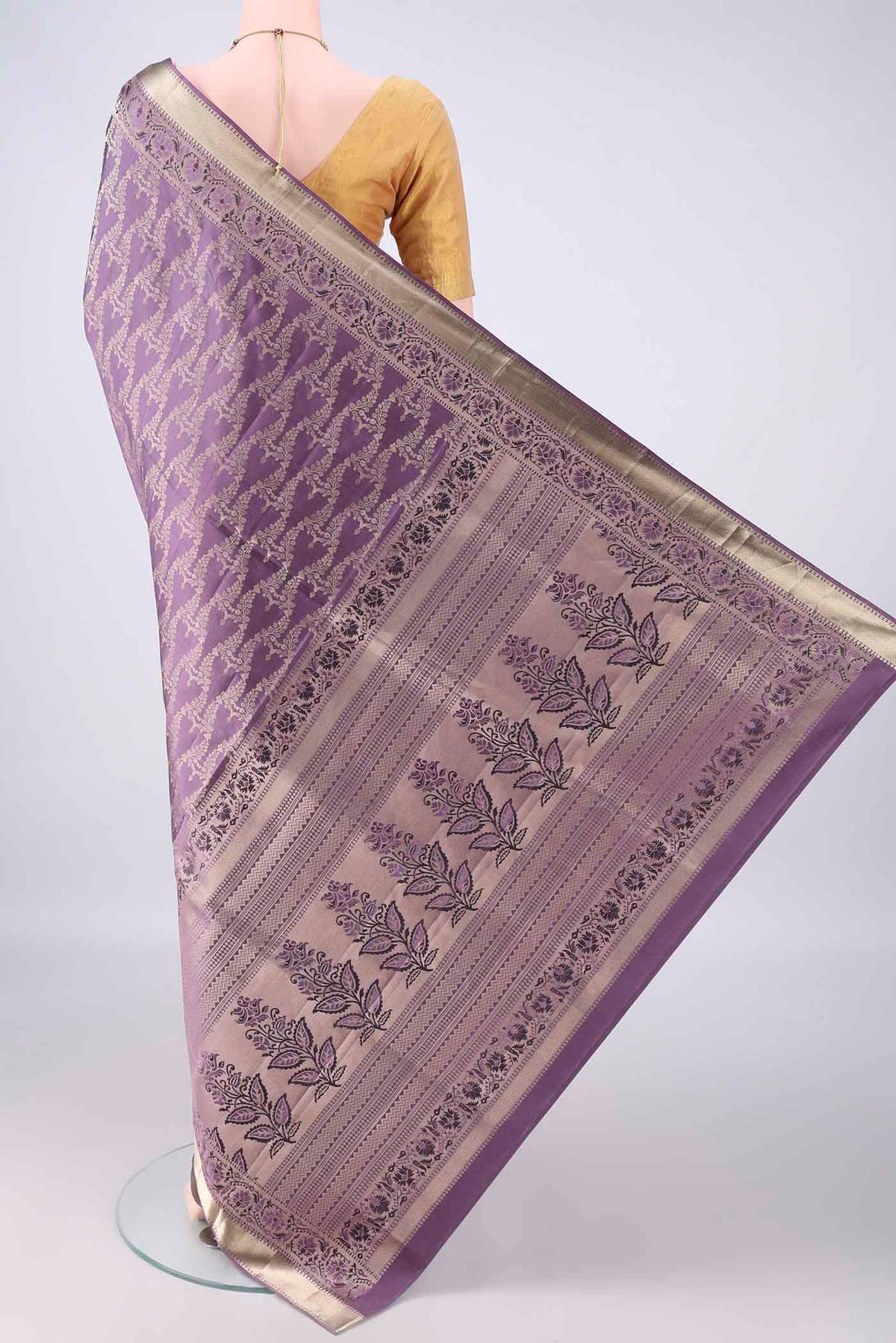 Flat view of Pure Silk Mauve Soft Saree with Zari Brocade on the body and Zari Border. 