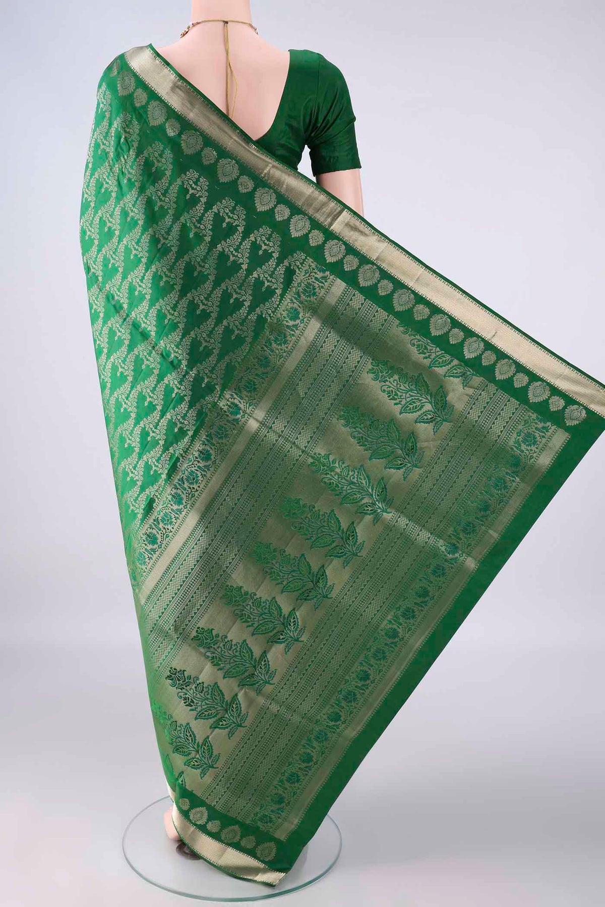 Flat view of Pure Silk Green Soft Saree with Zari Brocade on the body and Zari Border. 