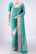 Pure Silk Sea Green Soft Saree with Zari Brocade on the body and Zari Border.  displayed on a mannequin