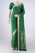 Pure Silk Green Soft Saree with Zari Brocade on the body and Zari Border.  displayed on a mannequin