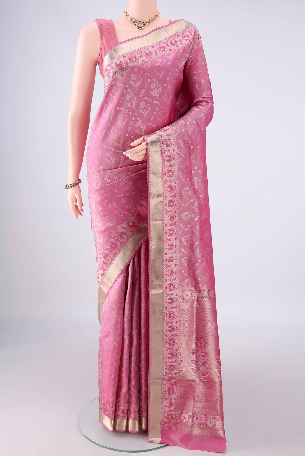 Pure Silk Rose pink Soft Saree with Zari Brocade on the body and Zari Border.  displayed on a mannequin