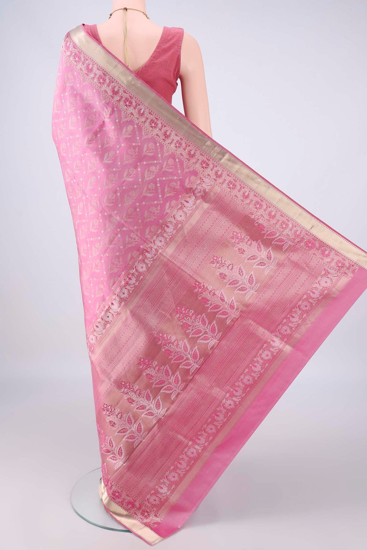 Flat view of Pure Silk Rose pink Soft Saree with Zari Brocade on the body and Zari Border. 