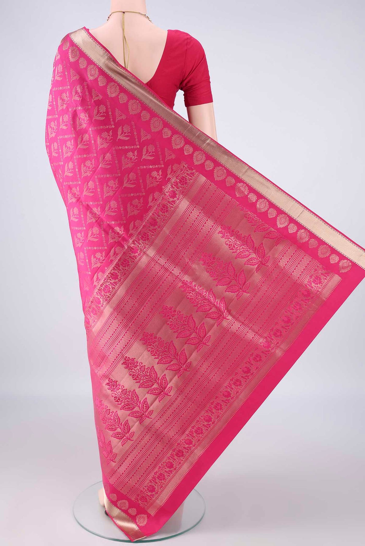 Flat view of Pure Silk Rani Pink Soft Saree with Zari Brocade on the body and Zari Border. 