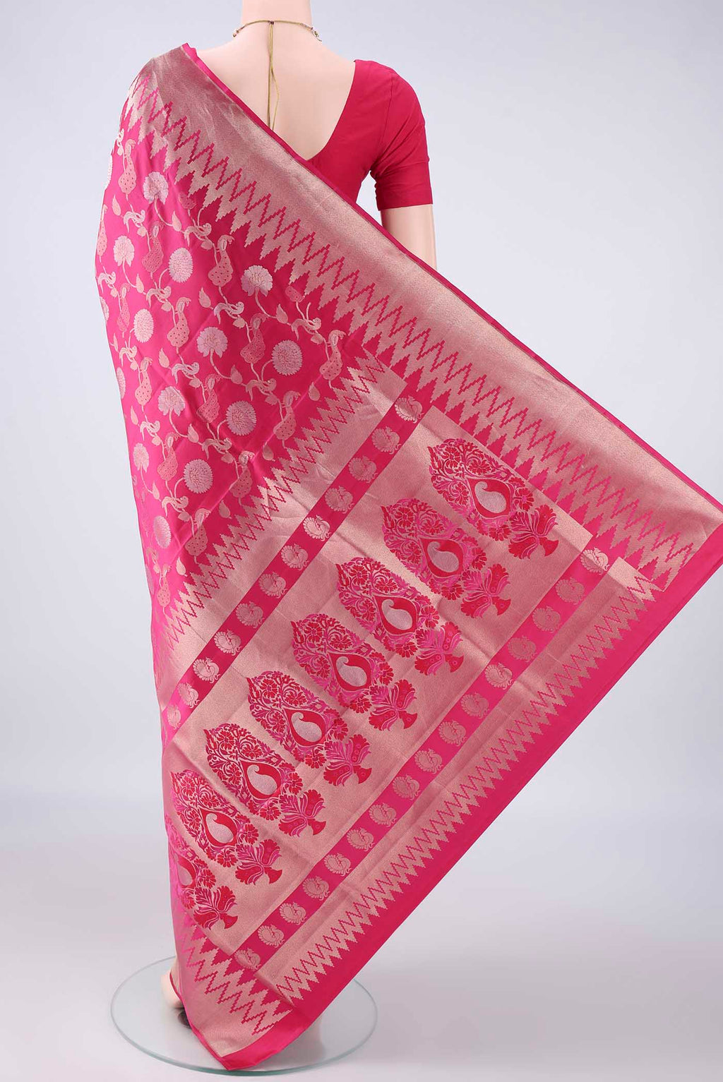 Flat view of Pure Silk Rani Pink Soft Saree with Zari Brocade on the body and Zari Border. 