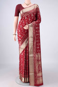 Pure Silk Maroon Soft Saree with Zari Butta on the body and Zari Border.  displayed on a mannequin