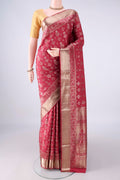 Pure Silk Coral Soft Saree with Zari Butta on the body and Zari Border.  displayed on a mannequin