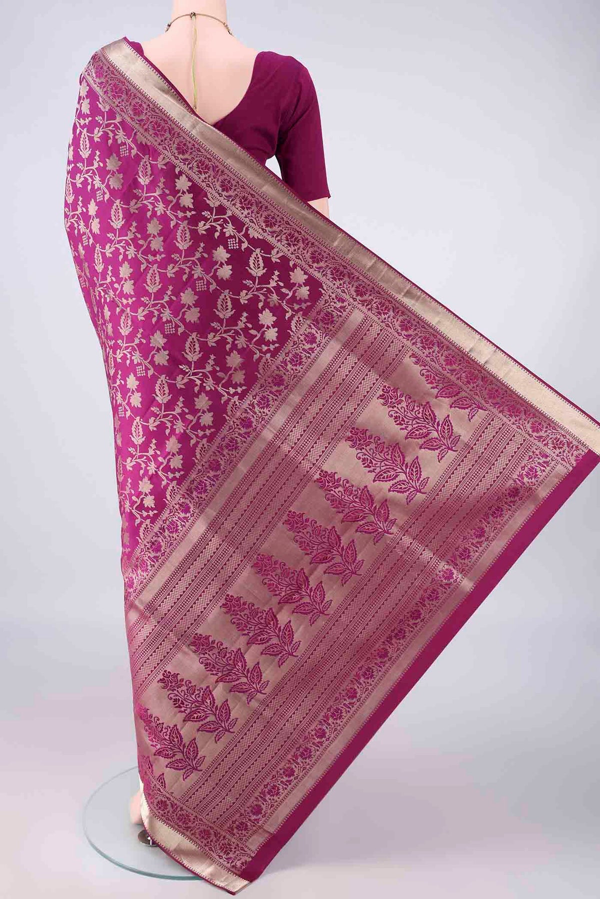 Flat view of Pure Silk Magenta Soft Saree with Zari Brocade on the body and Zari Border. 