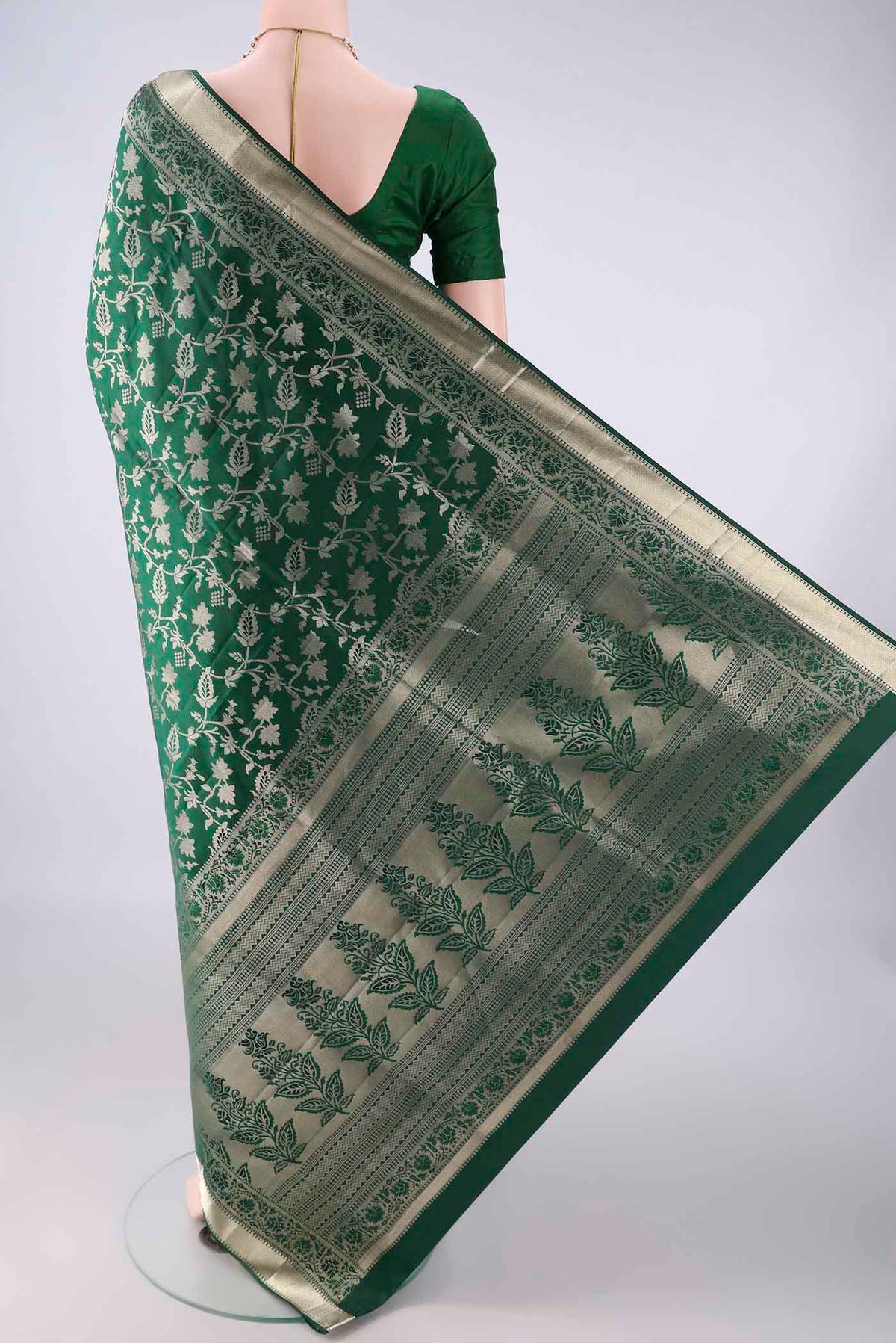 Flat view of Pure Silk Bottle Green Soft Saree with Zari Brocade on the body and Zari Border. 