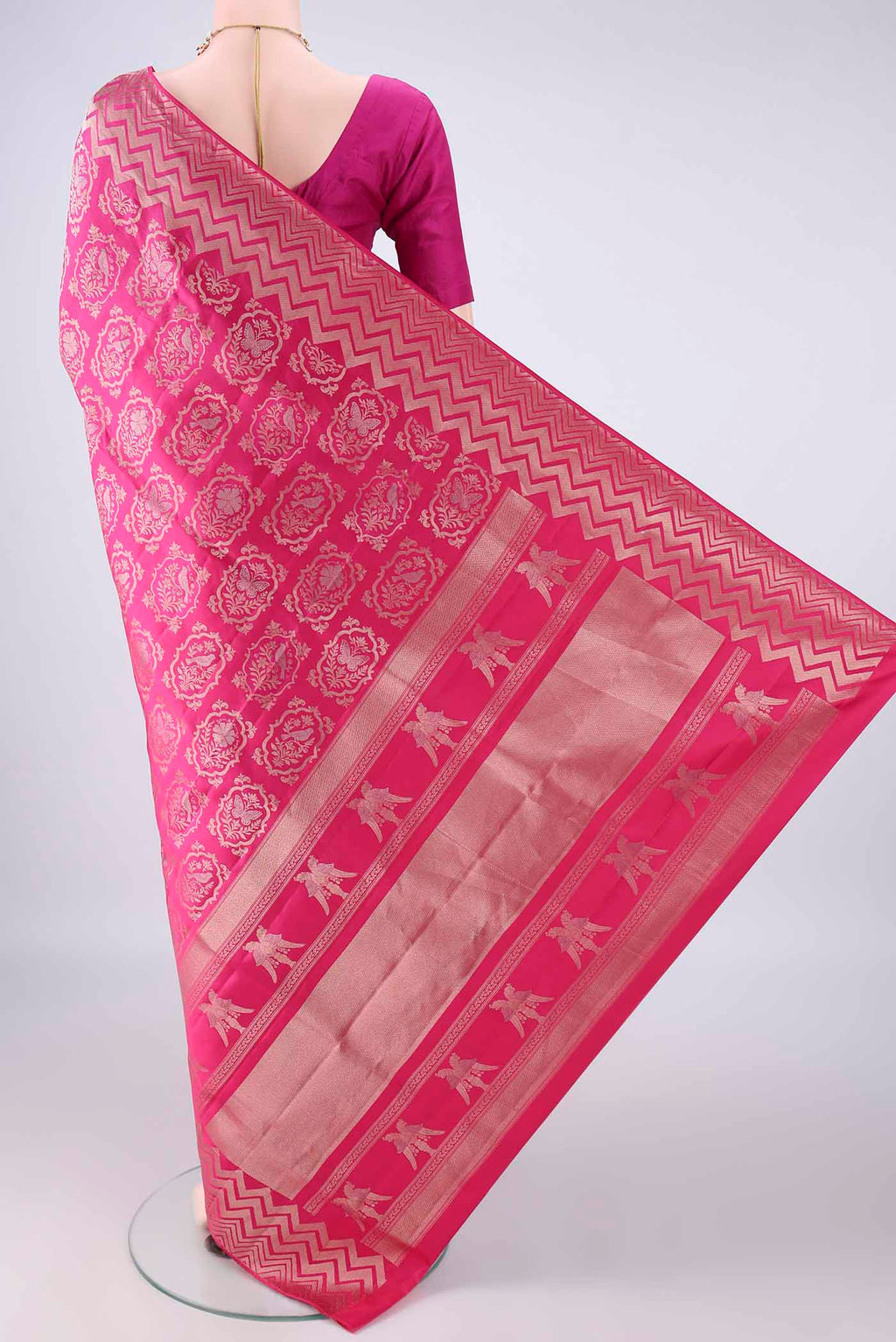 Flat view of Pure Silk Rani Pink Soft Saree with Zari Brocade on the body and Zari Border. 
