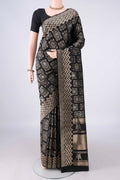 Pure Silk Black Soft Saree with Zari Brocade on the body and Zari Border.  displayed on a mannequin