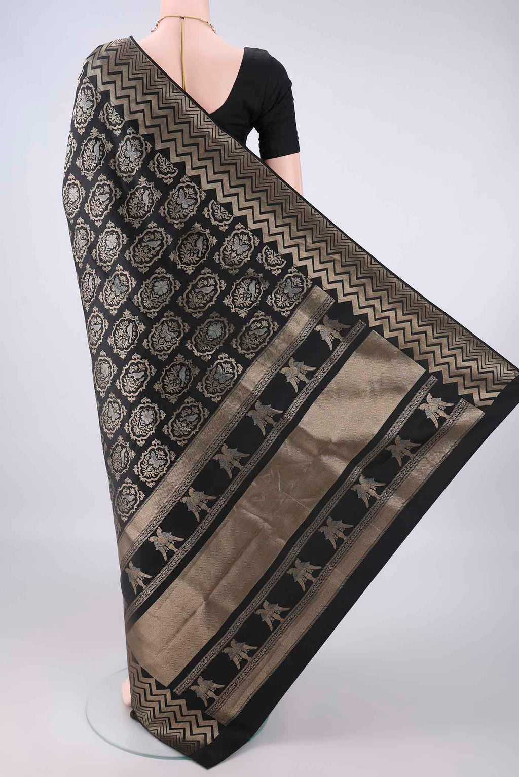 Flat view of Pure Silk Black Soft Saree with Zari Brocade on the body and Zari Border. 