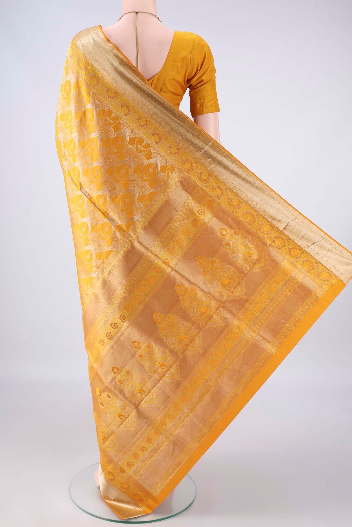 Flat view of Pure Silk Yellow Soft Saree with Zari Brocade on the body and Zari Border. 