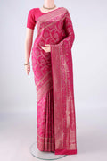Pure Silk Rani Pink Soft Saree with Zari Brocade on the body and Zari Border.  displayed on a mannequin