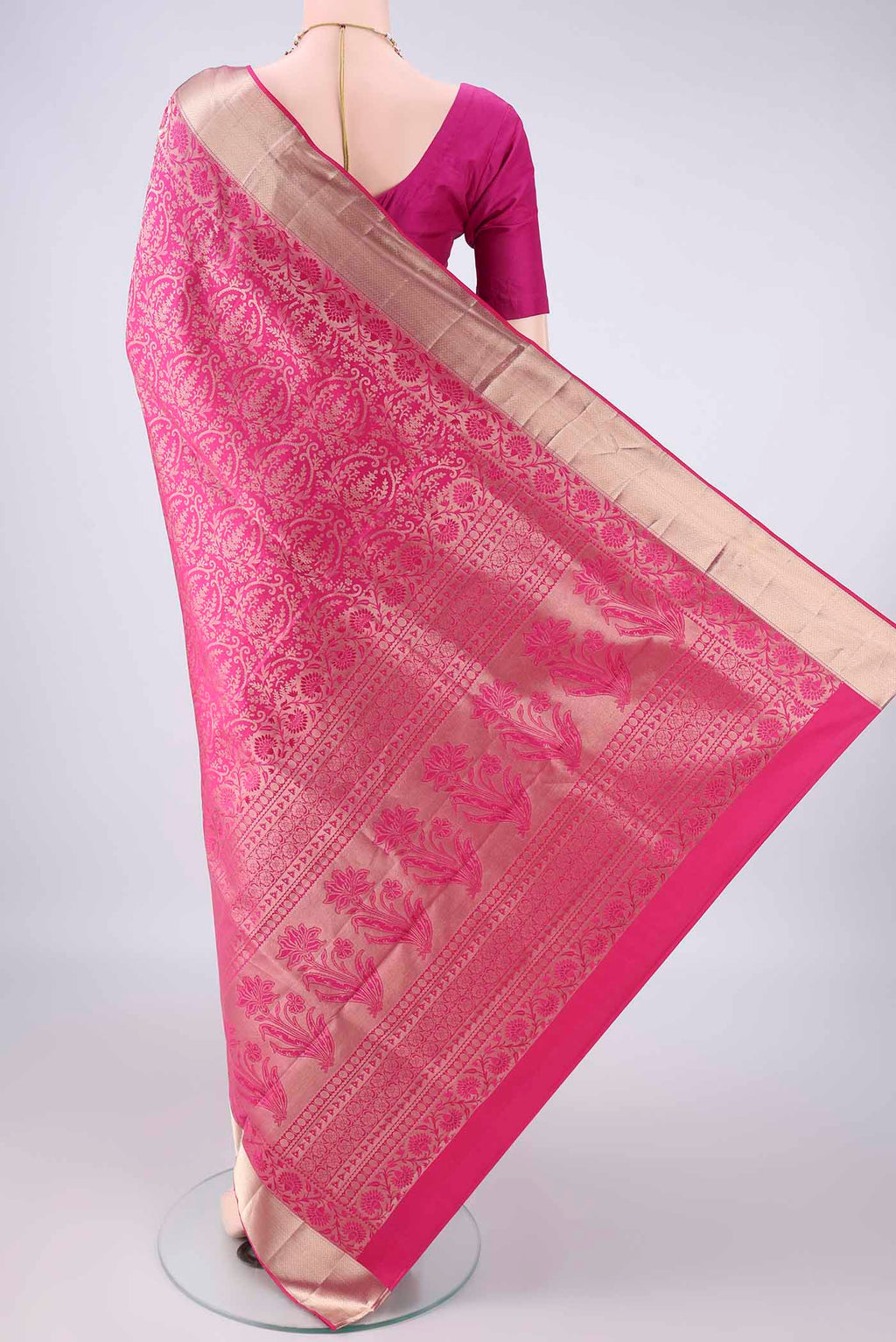 Flat view of Pure Silk Rani Pink Soft Saree with Zari Brocade on the body and Zari Border. 