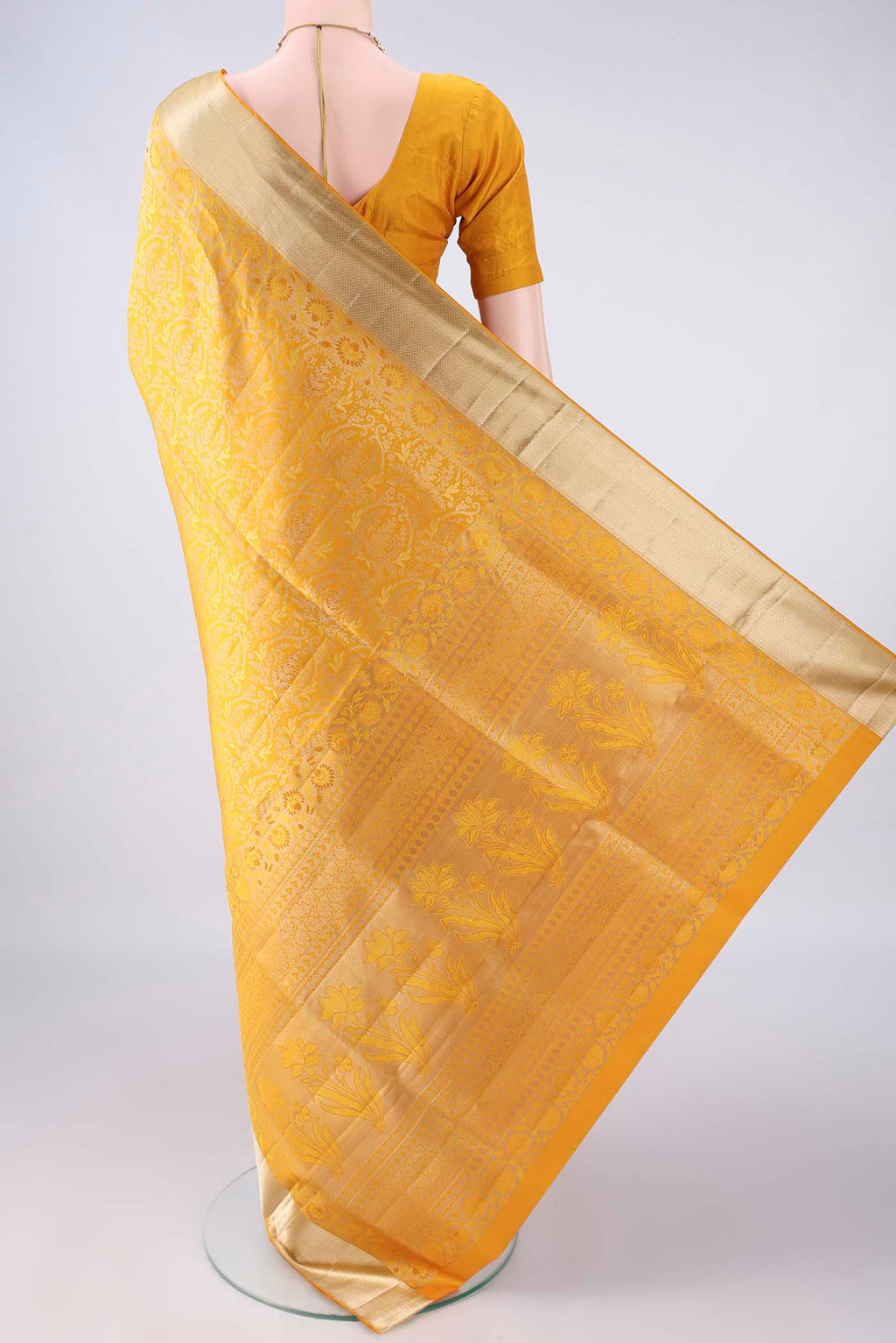 Flat view of Pure Silk Yellow Soft Saree with Zari Brocade on the body and Zari Border. 